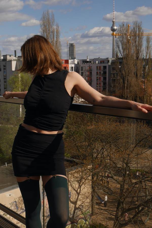Leonie on a balcony